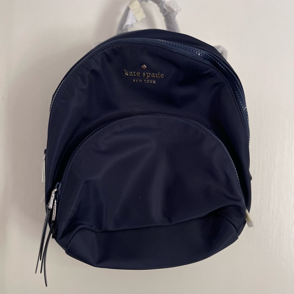 Kate Spade mini backpack in navy blue. Brand new still with tags and packaging.